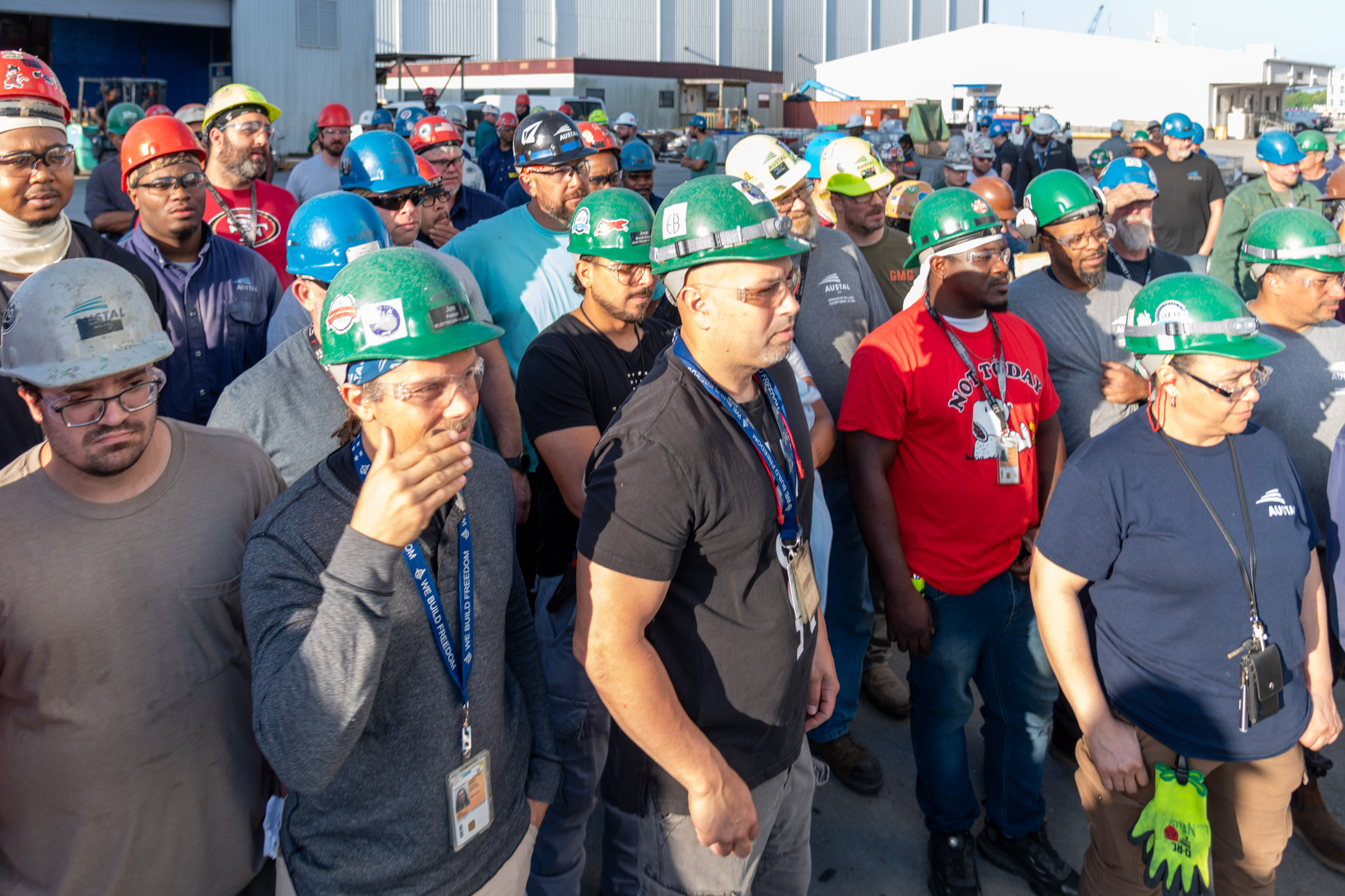 Austal USA employees hosting Rear Admiral Rucker