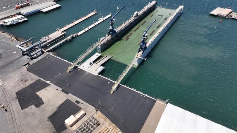 Austal USA's Dry Dock Independence partially submerged at our San Diego repair yard after receiving full certification